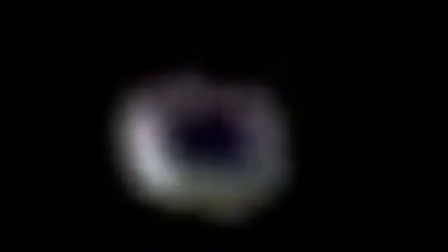 White Doughnut shaped UFO filmed at the ISS on the live feed.