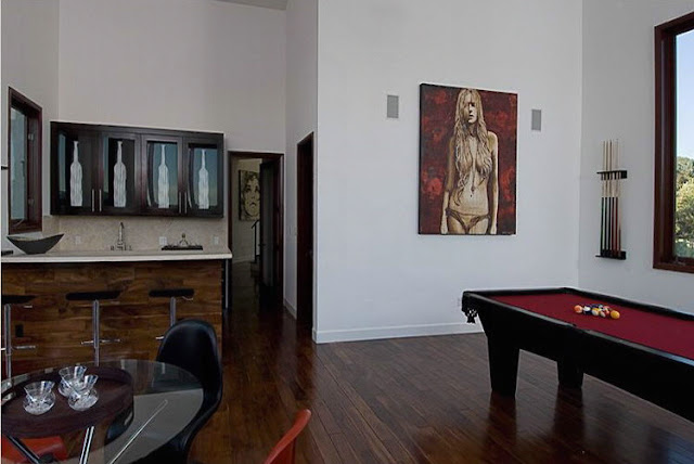 Picture of game room with pool table and private bar