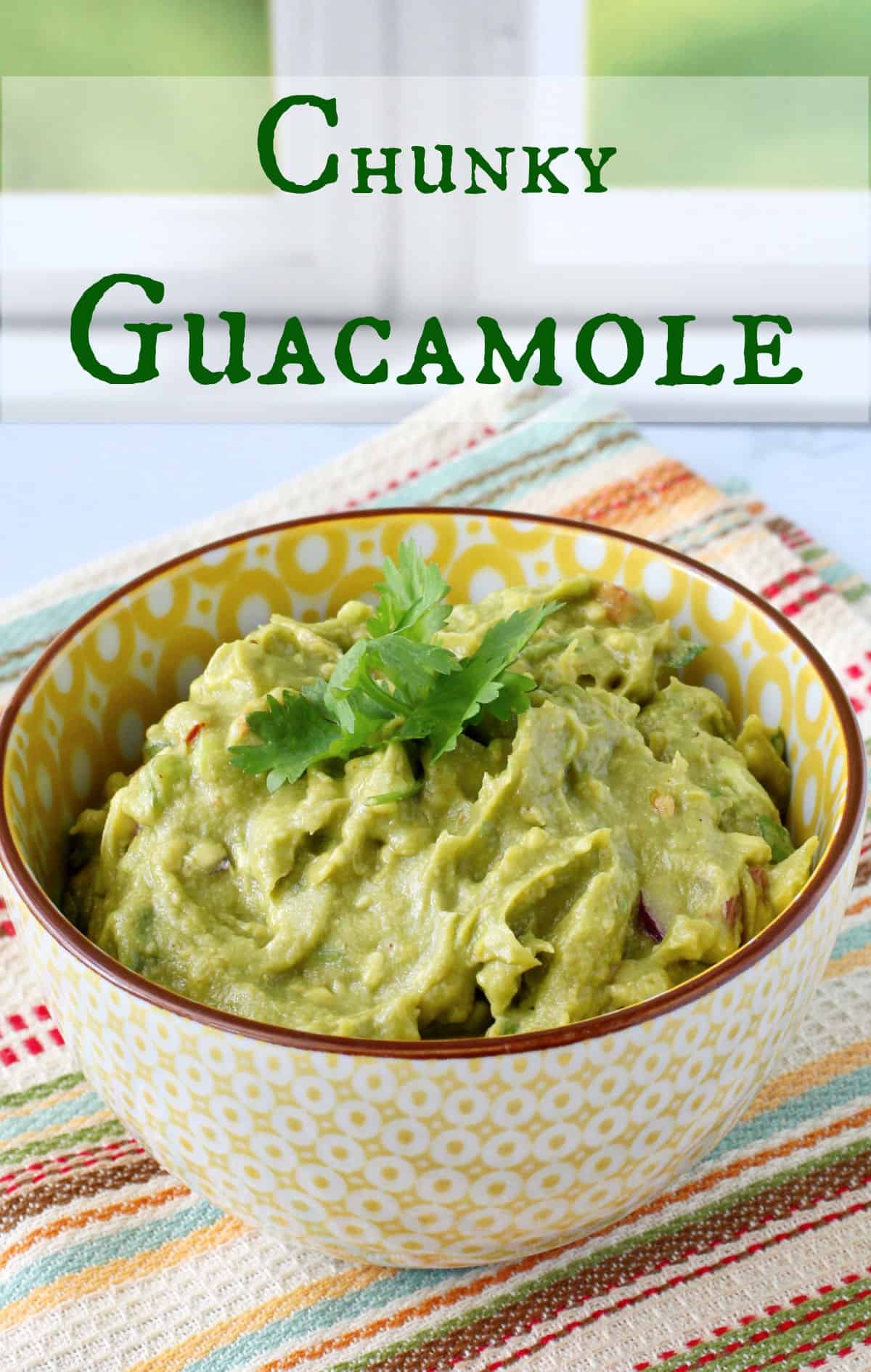 Homemade Chunky Guacamole in a yellow bowl.