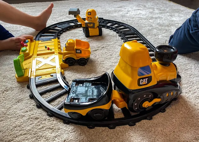 The train from the Cat Construction Junior Crew Power Tracks going round the track