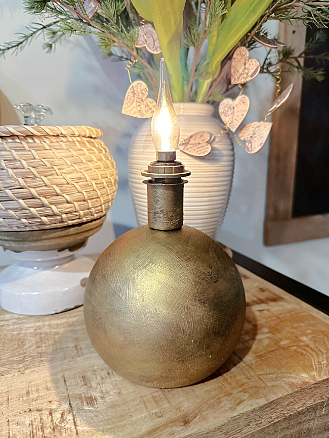 gold accent light with flame bulb and basket