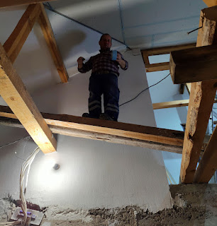 Bekir working the other side, on the old beams