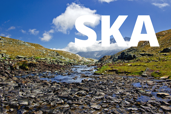 Definition of the phoneme SKA: Image of a small river coming from a Mountain far away in the blue sky