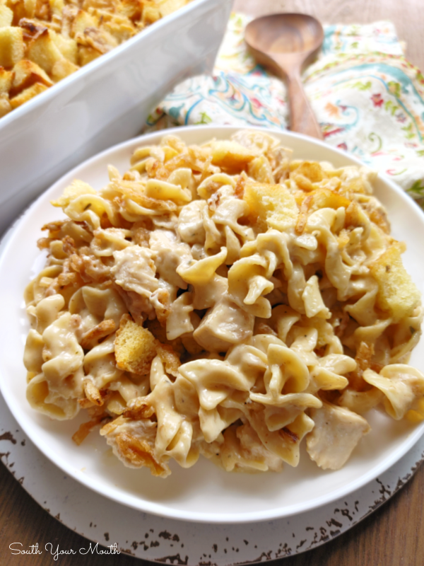 French Onion Chicken Casserole! An easy, creamy chicken noodle casserole with French onion soup, topped with toasty buttered bread cubes and crispy fried onions.