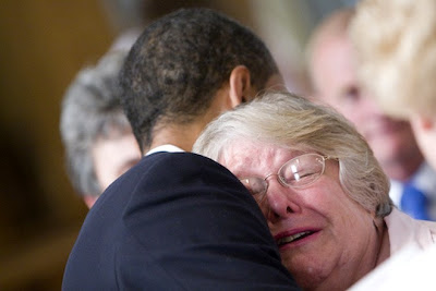 Woman cries while hugging Obama in Lima, Ohio