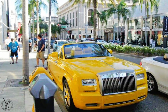 yellow rolls royce car