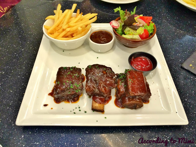Dean & Deluca's BBQ Ribs with a side of fries and a small salad