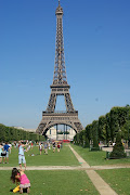 The Eiffel Tower is an iron lattice tower located on the Champ de Mars in . (dsc )