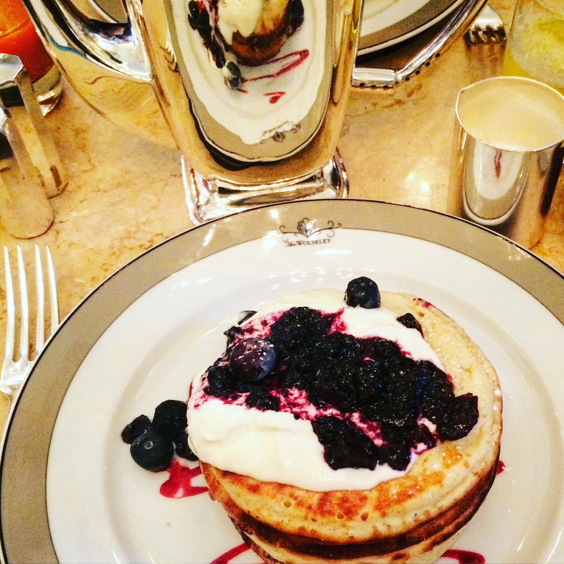 Pancakes with berries at luxury london breakfast spot The Wolseley
