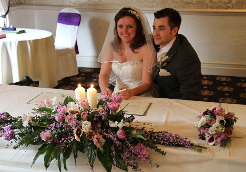 Emma's wedding bouquet was a glorious collection of deep purple and ivory 
