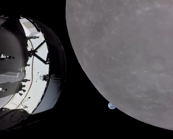 A video screenshot of NASA's Orion spacecraft approaching the Moon as the Earth sets in the distance...on November 21, 2022.