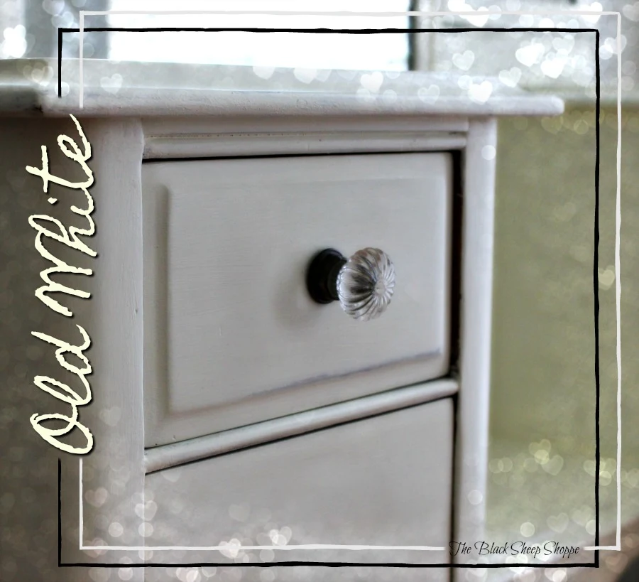 Old white chalk paint on an antique vanity.