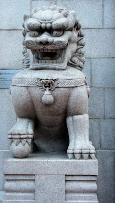 Image of the original Bank of China (in Hong Kong) male Imperial Guardian Lion, on the left of the entrance.