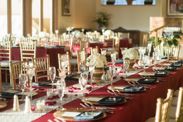 gold and burgundy reception tables