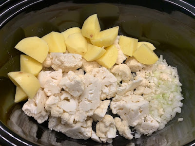 Cauliflower soup ingredients in a slow cooker