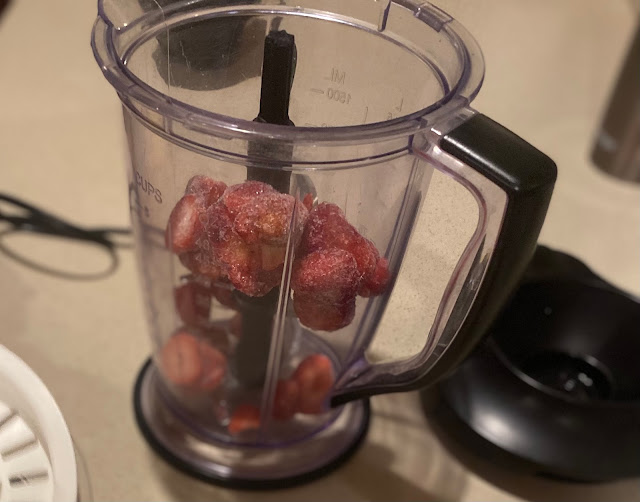 frozen strawberries in a blender