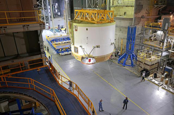 At NASA's Michoud Assembly Facility in New Orleans, Louisiana, engineers are about to place the engine section for the Space Launch System's Artemis 2 core stage booster into horizontal position...on February 11, 2023.