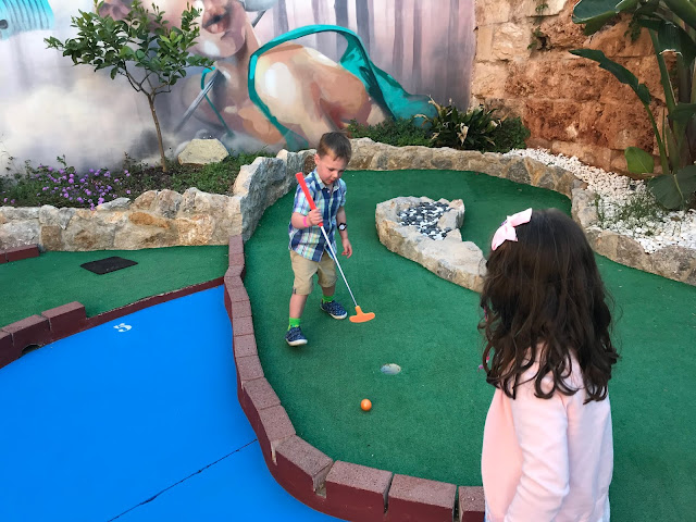 My youngest two children playing mini golf in Majorca