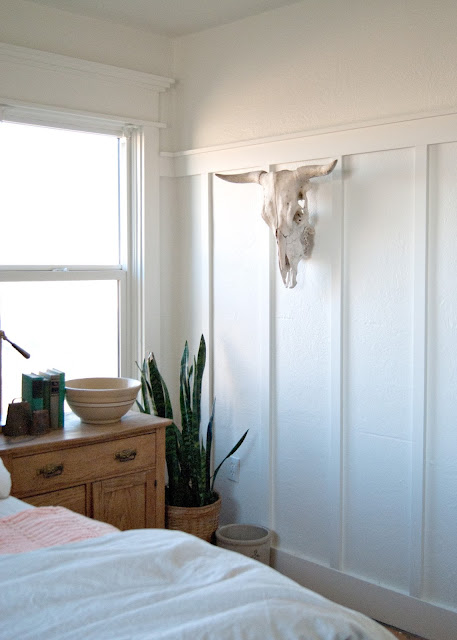 Farmhouse Master Bedroom Reveal - Benjamin Moore Simply White, farmhouse trim , board and batten, cow skull, snake plant