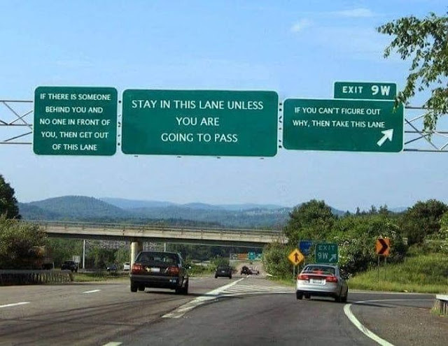 Road signs for left lane bandits