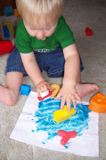 toddler doodling in playdough