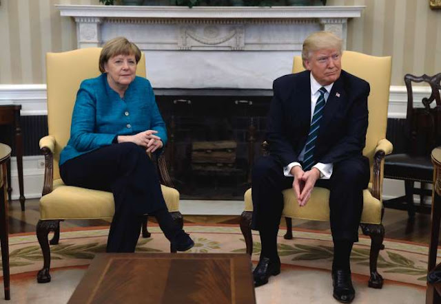 Merkel asks for a handshake, Trump doesn't respond