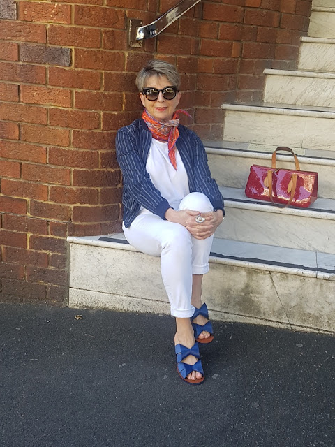 White outfit with bright accessories