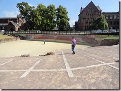 Edward walking in the area where the large seating area would have been in the 2000 year old Roman ruins of Roman Amphitheatre found in Chester, England
