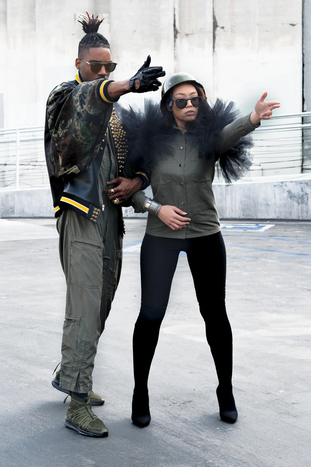 men and woman wearing military outfits and posing to the camera