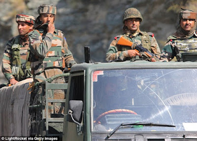 A convoy of Indian troopers passing through the border line area in Uri sector