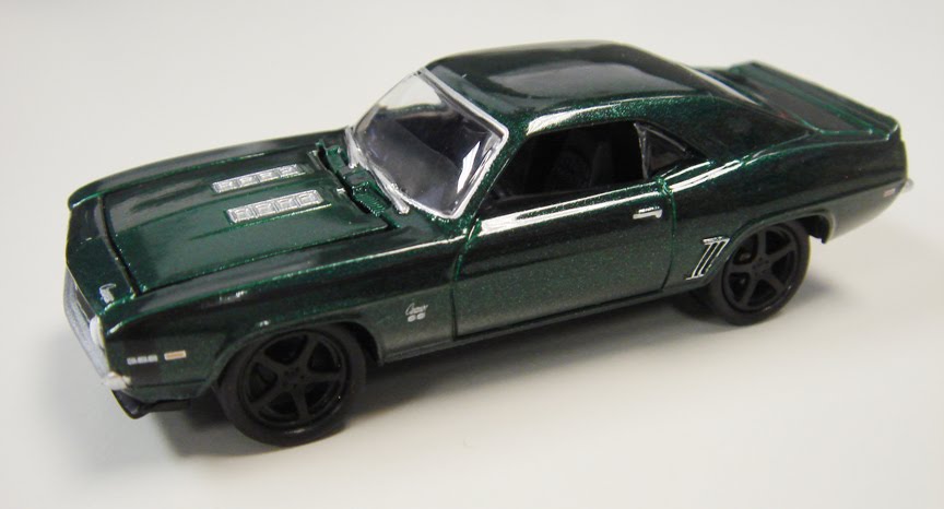 The'69 Camaro is an SS396 covered in metallic green