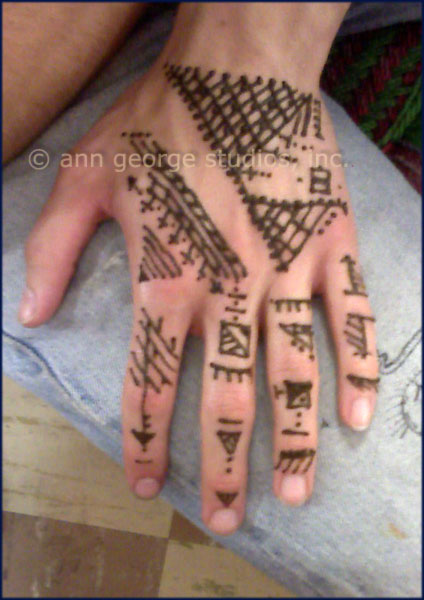 Here is an example of a free hand free spirit henna tattoo for a man