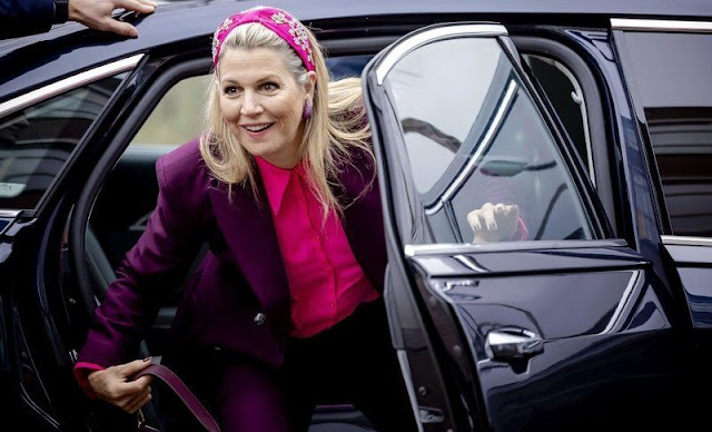 Queen Maxima wore a tailored double-breasted purple blazer suit by Zara. NamJosh geometric embellished pink headband
