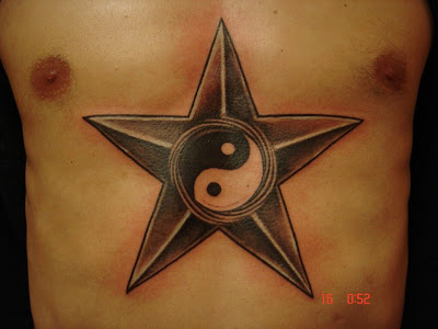 Star and Yin Yang Tattoo in the chest