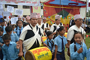 Tamu group lead the procession of school children (copy of school children and local band in procession)