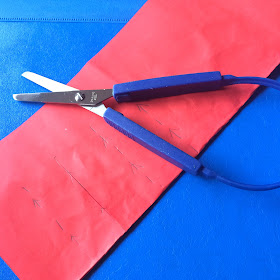 red paper and easigrip scissors