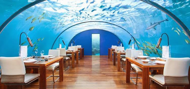 Restaurant with glass ceiling under the ocean