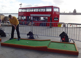 Crazy Golfing at the Pier Head in Liverpool on a summer pop-up course 