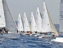 J/80 one-design sailboats- sailing off starting line- 