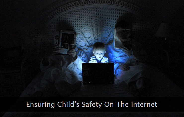 A toddler browsing internet on a laptop