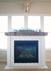 Fireplace Makeover - DIY Fireplace makeover using reclaimed and salvaged materials - octagon & dot tile, reclaimed wood,  white paint, planking - all for under $60! Before and After and links to all the steps!