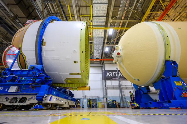 At NASA's Michoud Assembly Facility in New Orleans, Louisiana, the engine section for the Space Launch System's Artemis 2 core stage booster is placed into position to be mated with the rest of the booster...on February 22, 2023.