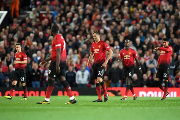Players of Manchester United looks dejected during the Premier League match between Manchester United and Tottenham Hotspur at Old Trafford on August 27, 2018 in Manchester, United Kingdom