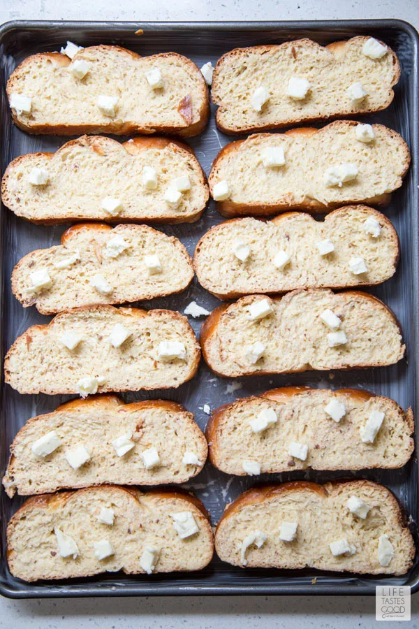 Oven French Toast dotted with butter ready to bake