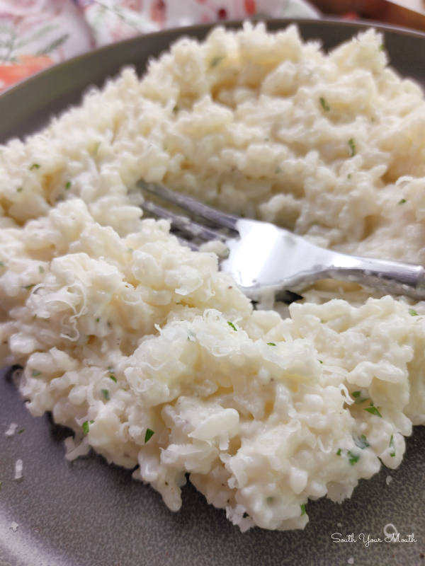 Creamy Parmesan Rice! A simple side dish recipe for creamy rice with garlic, butter and parmesan cheese. Like risotto but easy!