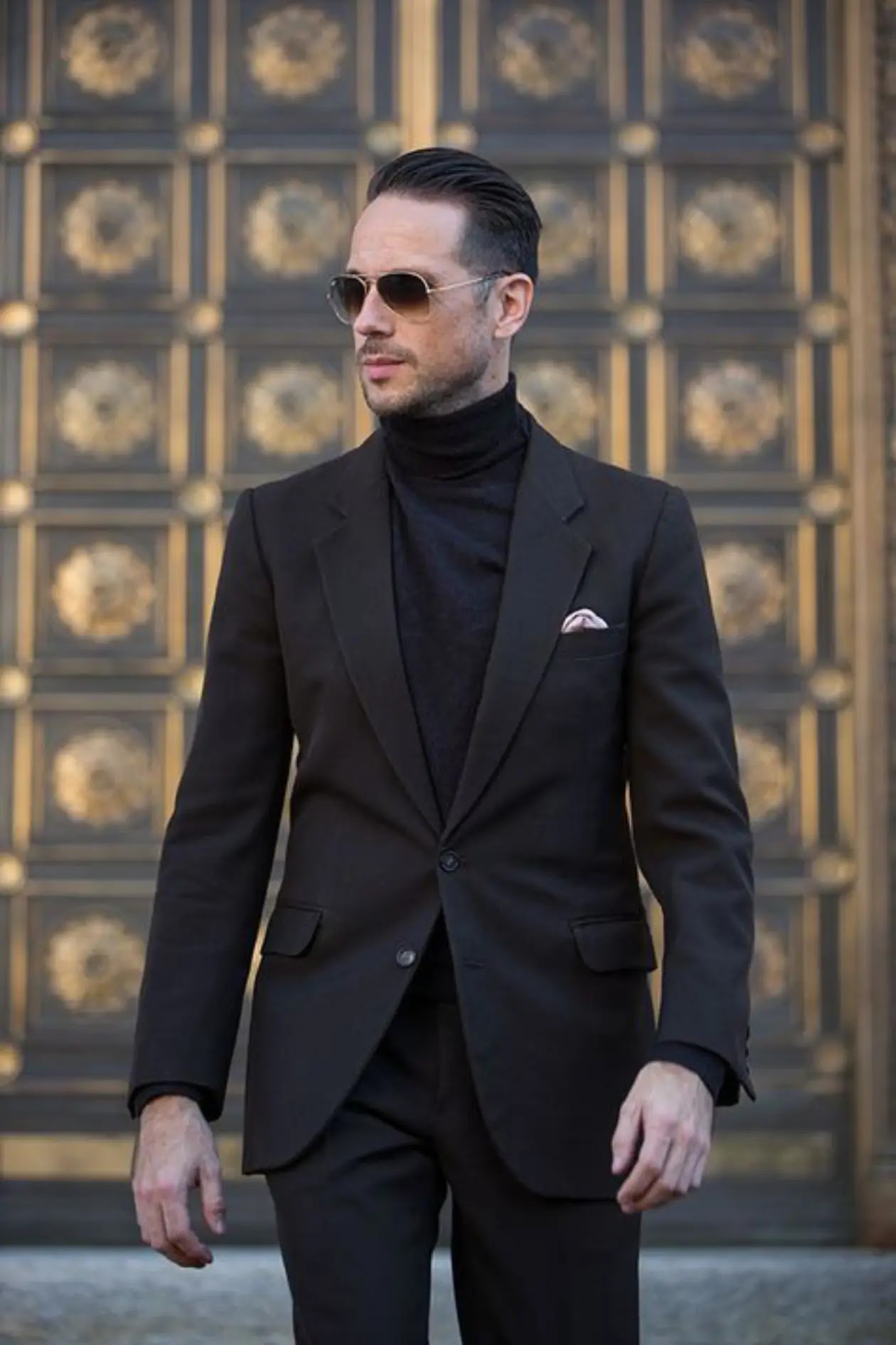 A chic and versatile pairing of a form-fitting turtleneck sweater under a sharp blazer, blending warmth with professionalism.