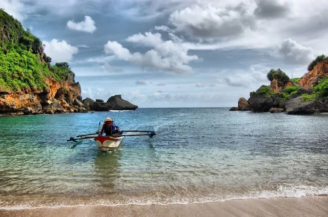 ngrenehan beach with local sailor boat