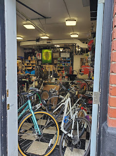 McCrank's doorway - shop full of bikes and bike parts