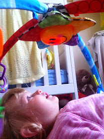 Eva on her baby einstein mat 