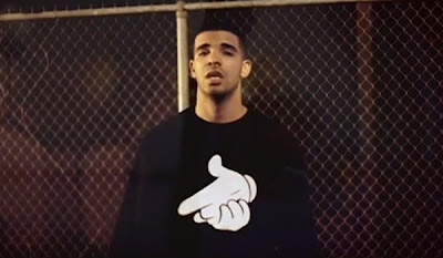 Drake wearing a Crooks and Castles gun hands sweater